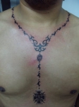 Los tatuajes religiosos de rosarios
